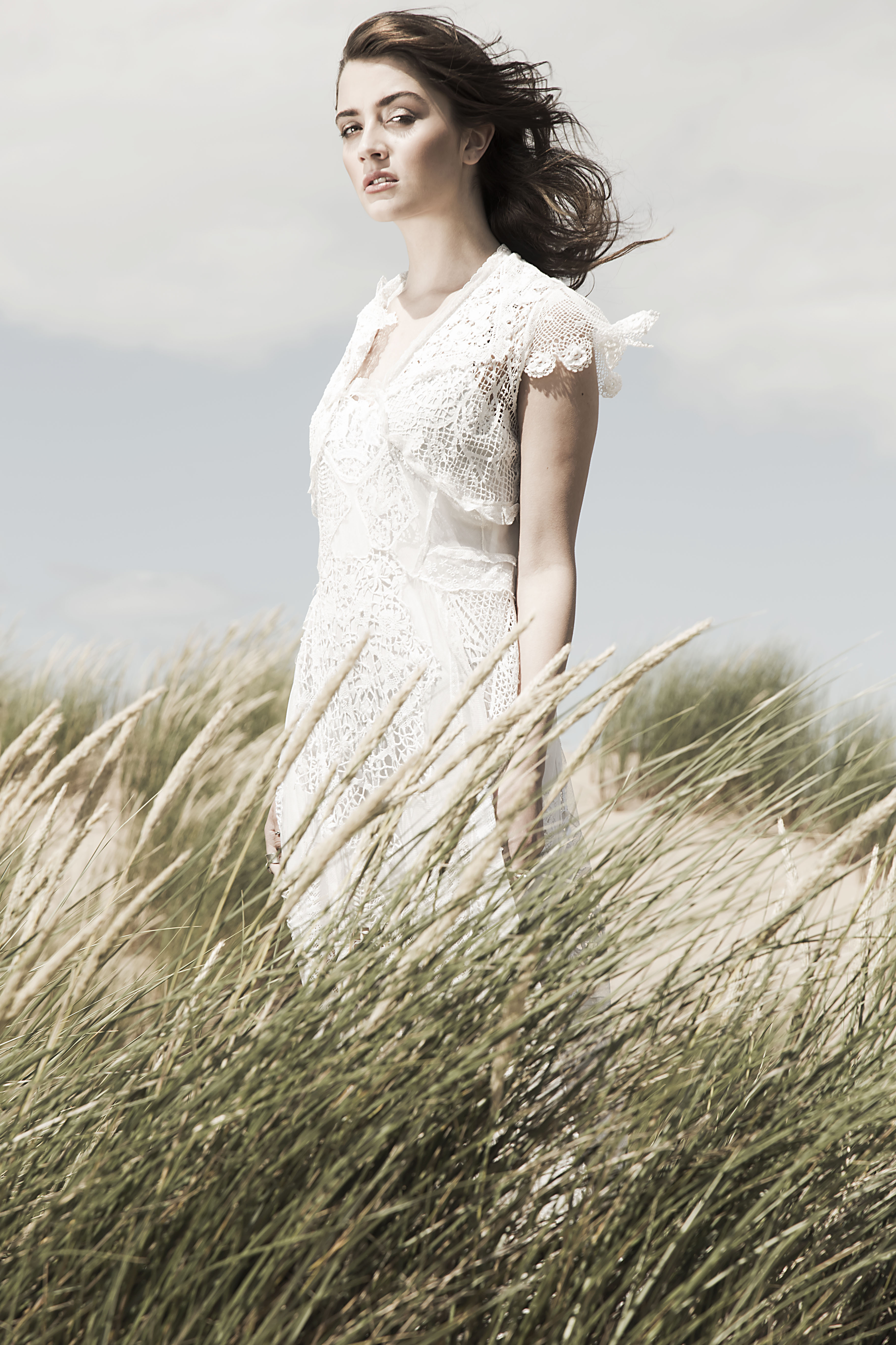 Fashion editorial beach shoot lace dress